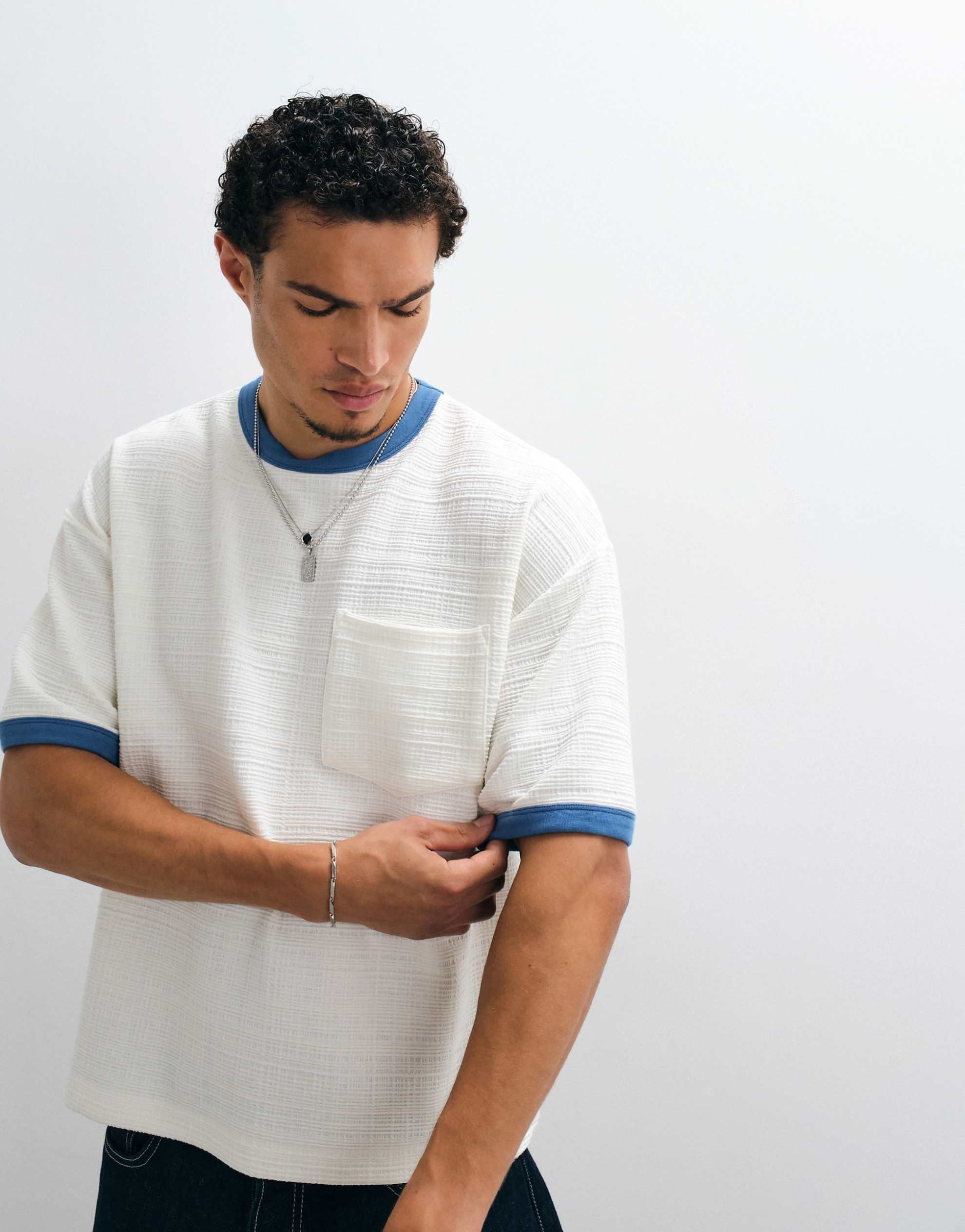 DESIGN boxy oversized t-shirt pocket cream texture.