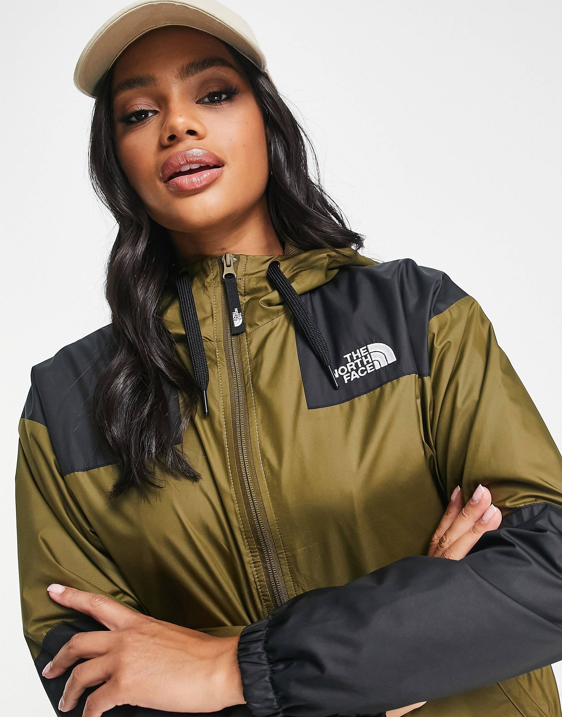 Khaki and black top north face jacket